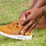 a person touching his ankle