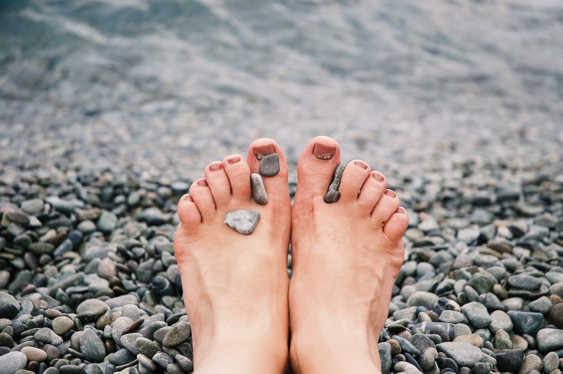 stones on woman s feet