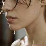 sweaty woman in close up photography